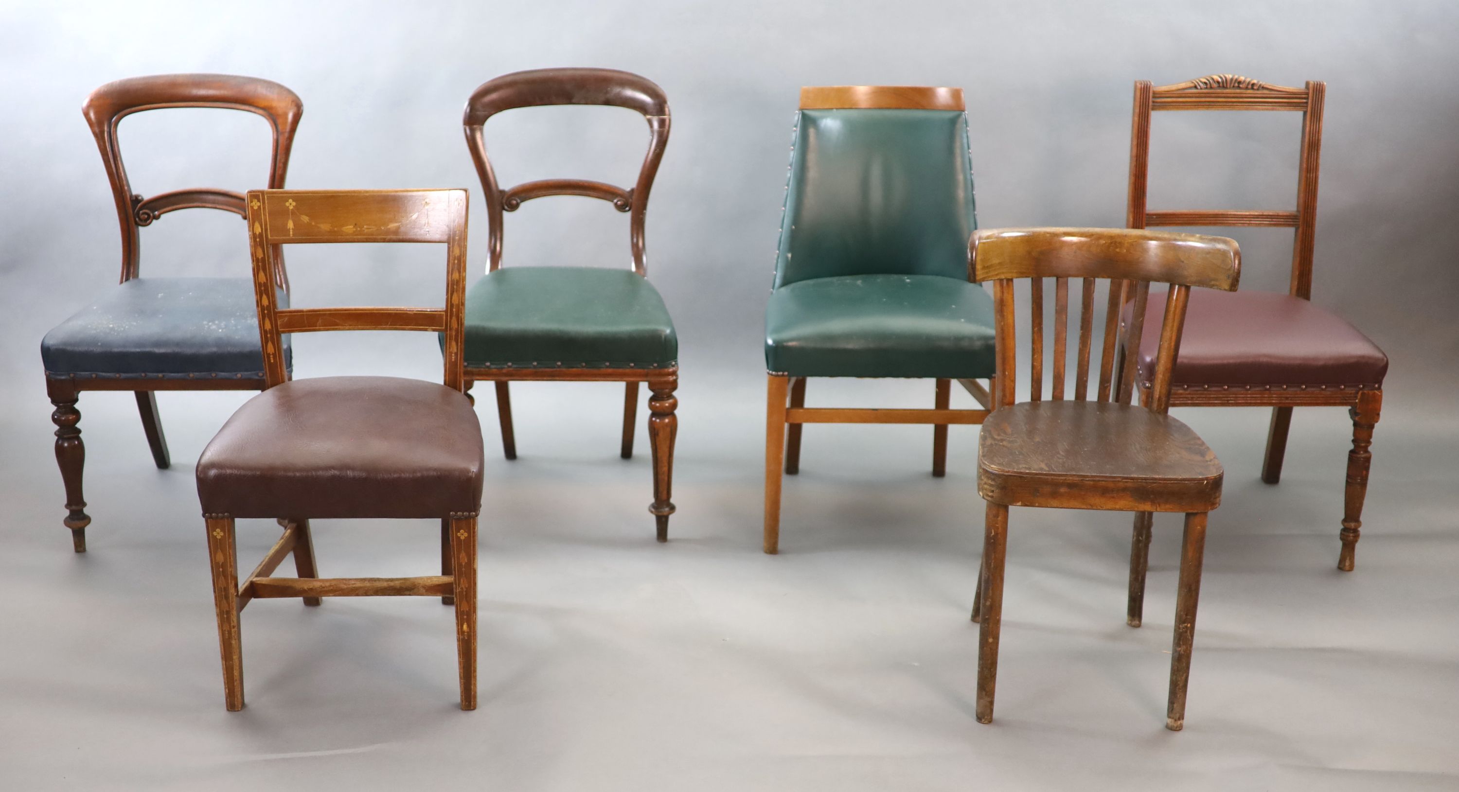 Six chairs from the Libary of the Royal College of Surgeons, including two Victorian balloon back, a marquetry inlaid Edwardian example and a 1940's green leatherette example